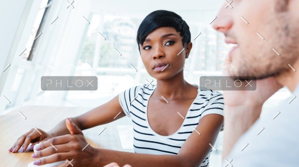 demo-attachment-307-Businesswoman-and-smiling-businessman-discussing-work-in-restaurant@2x